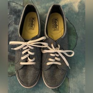 Ked’s Ladies size 8, blue denim sneakers with blue/white stripe trim.
